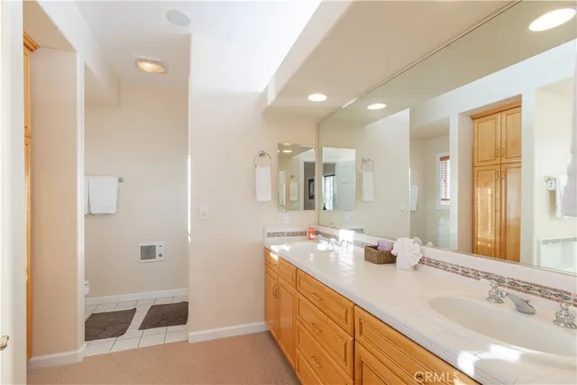 a bedroom with furniture and a flat screen tv