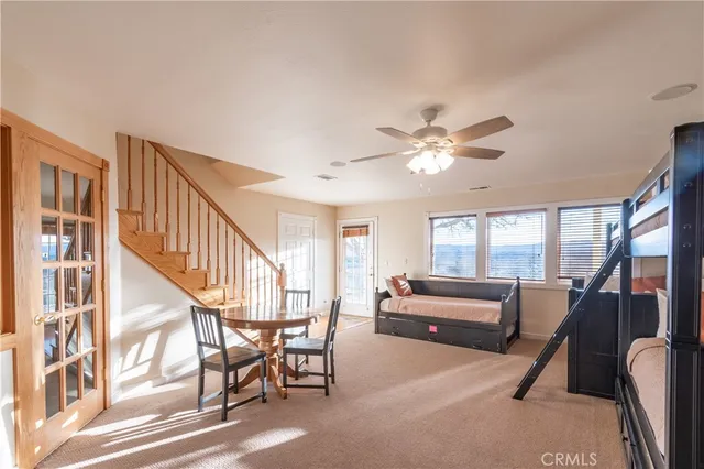 a bedroom with a large bed and a window