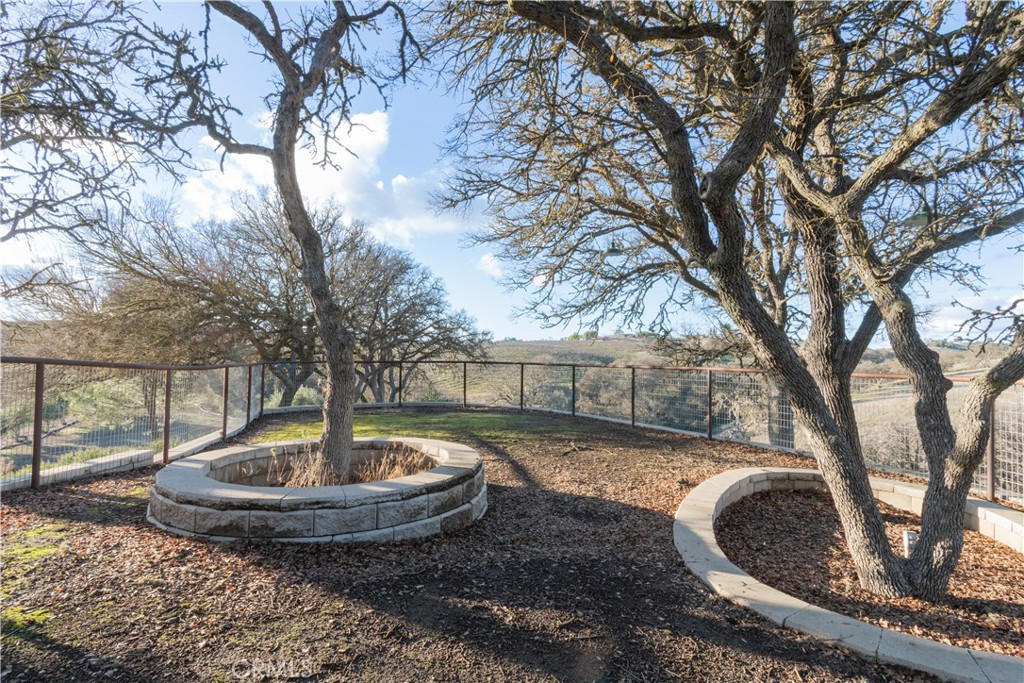 390 San Marcos Road Paso Robles, CA 93446 - Photo 23 of 62 a view of a backyard with plants and a tree
