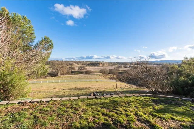 a large kitchen with granite countertop a large counter top and sink