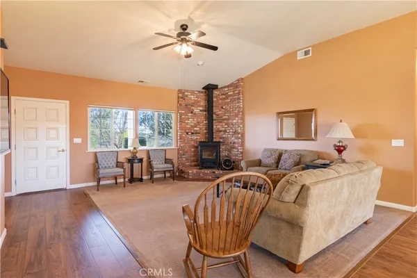 a bedroom with a bed and a table in it next to a window