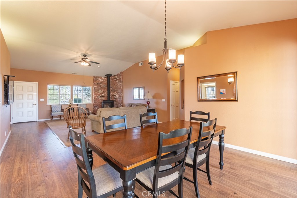 390 San Marcos Road Paso Robles, CA 93446 - Photo 40 of 62 a view of a dining room with furniture wooden floor and chandelier