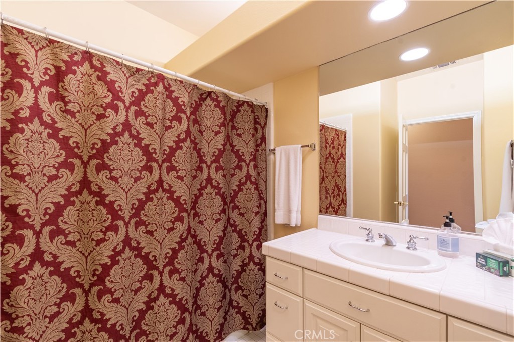 390 San Marcos Road Paso Robles, CA 93446 - Photo 44 of 62 a bathroom with a sink and a mirror