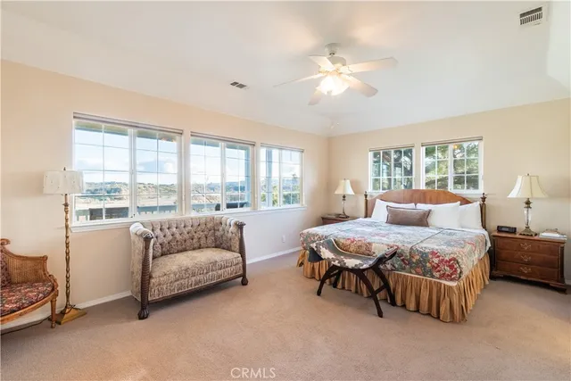 a view of a dry yard with mountain and lake view