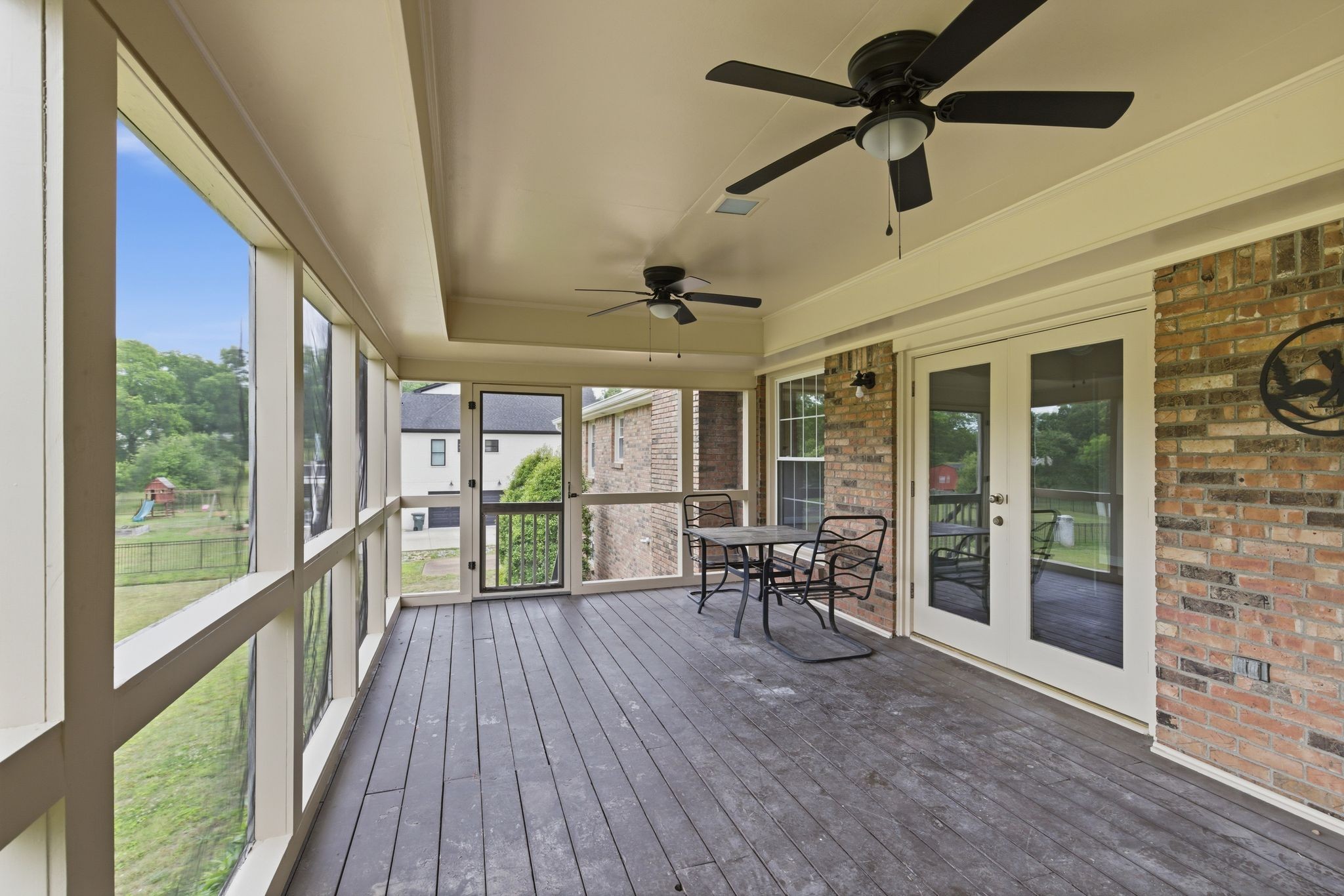 213 Rising Sun Lane Old Hickory, TN 37138 - Photo 31 of 37 a view of a porch with chairs and backyard
