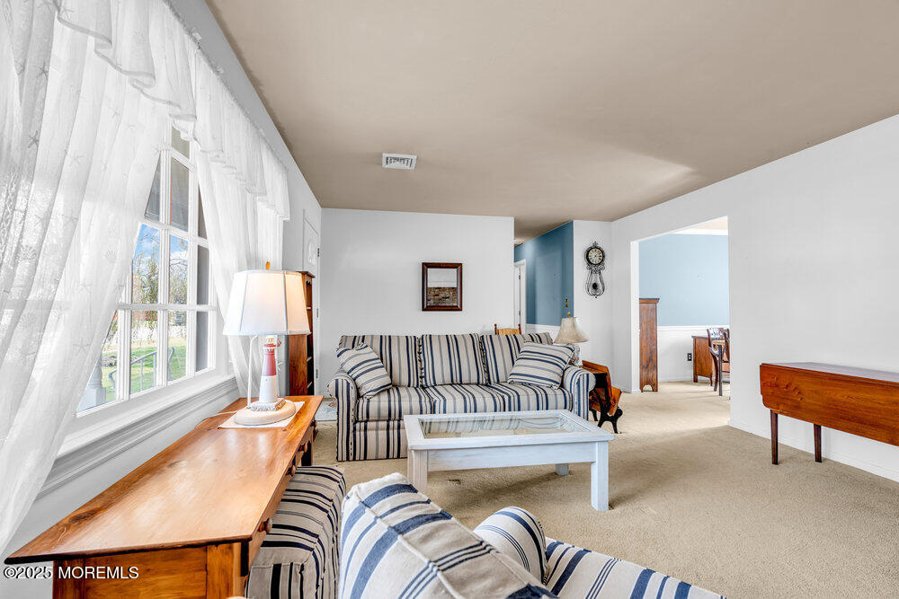 9 Scheiber Drive Brick, NJ 08723 - Photo 15 of 53 a living room with furniture and a large window