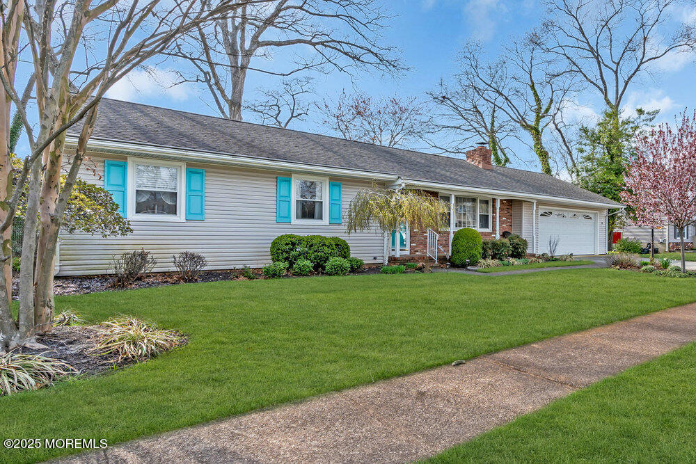 9 Scheiber Drive Brick, NJ 08723 - Photo 2 of 53 a front view of a house with garden