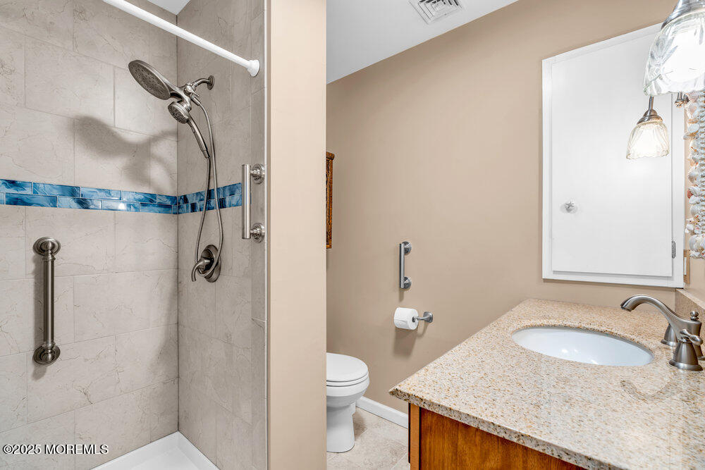 9 Scheiber Drive Brick, NJ 08723 - Photo 23 of 53 a bathroom with a granite countertop sink toilet and shower
