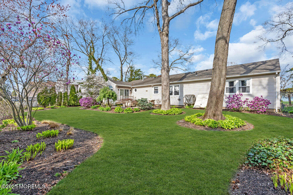 9 Scheiber Drive Brick, NJ 08723 - Photo 30 of 53 a front view of a multi story residential apartment building with yard and green space