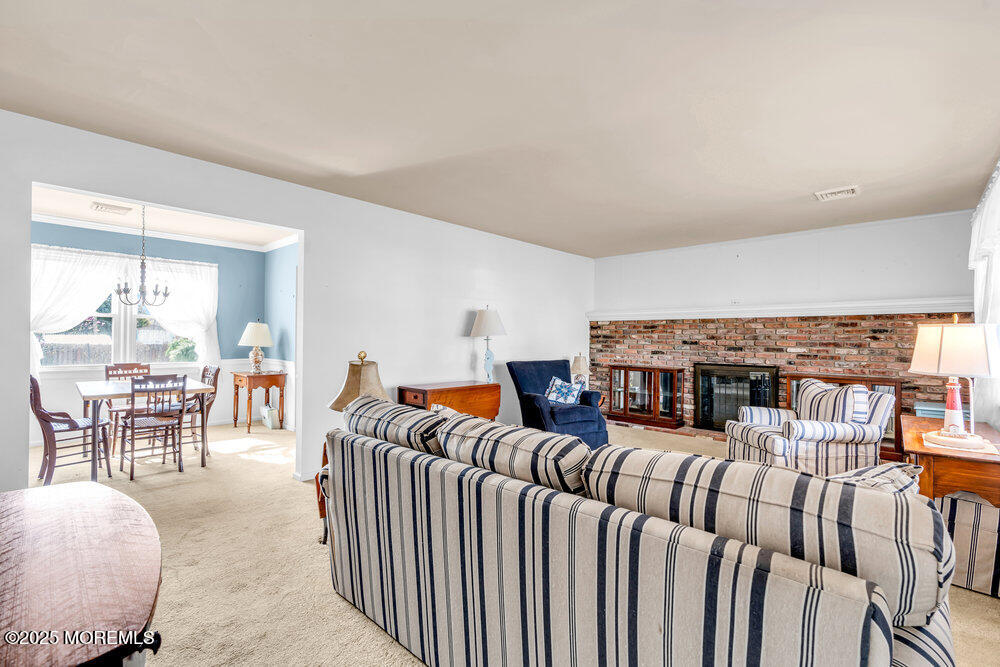 9 Scheiber Drive Brick, NJ 08723 - Photo 39 of 53 a living room with furniture a rug and white walls