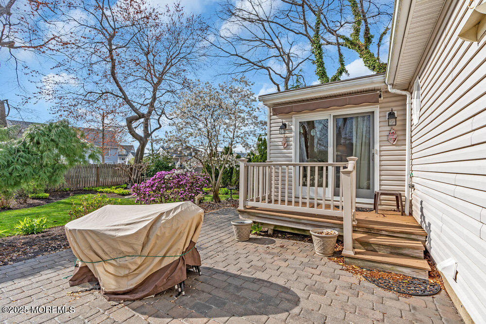 9 Scheiber Drive Brick, NJ 08723 - Photo 42 of 53 a view of a chair and table in backyard of the house