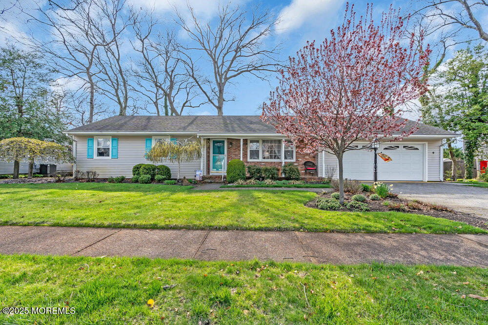 9 Scheiber Drive Brick, NJ 08723 - Photo 49 of 53 a front view of a house with a garden