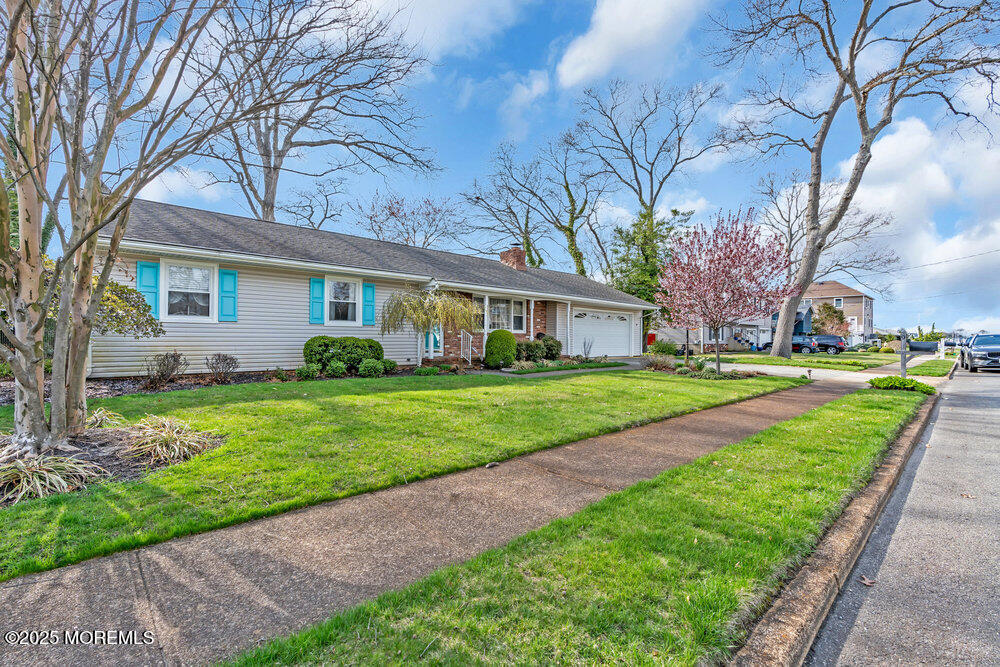 9 Scheiber Drive Brick, NJ 08723 - Photo 50 of 53 a front view of house with yard and green space