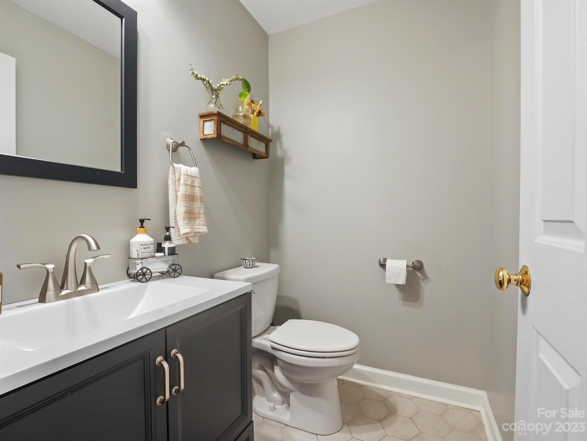 25 Falcon Crest Drive Fairview, NC 28730 - Photo 15 of 41 a bathroom with a sink a toilet and mirror