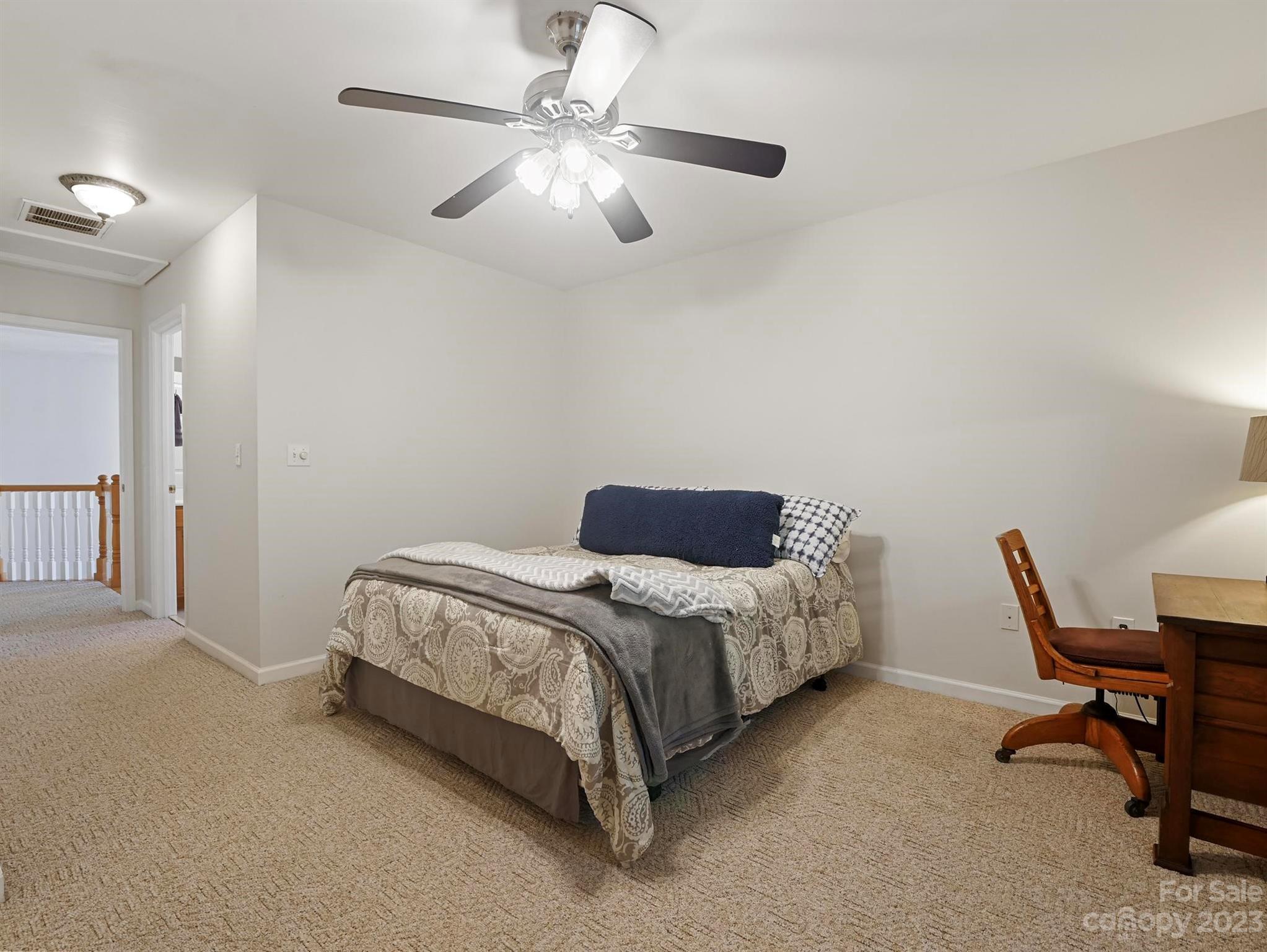 25 Falcon Crest Drive Fairview, NC 28730 - Photo 21 of 41 a bed room with a bed and a chair