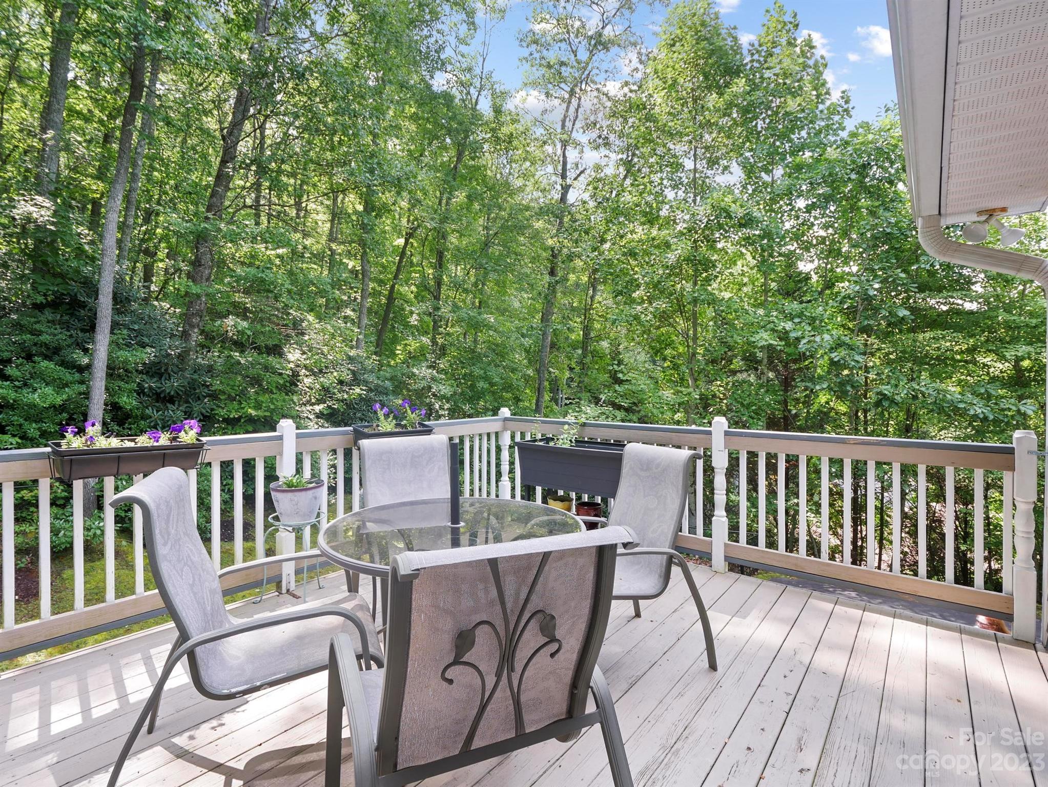 25 Falcon Crest Drive Fairview, NC 28730 - Photo 30 of 41 a view of a deck with two chairs and a table