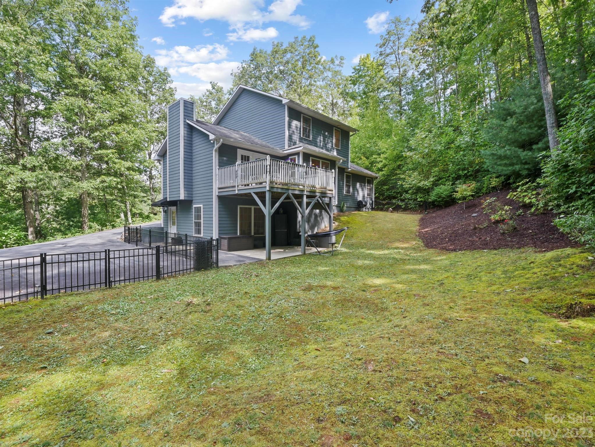 25 Falcon Crest Drive Fairview, NC 28730 - Photo 33 of 41 a view of a house with backyard and porch