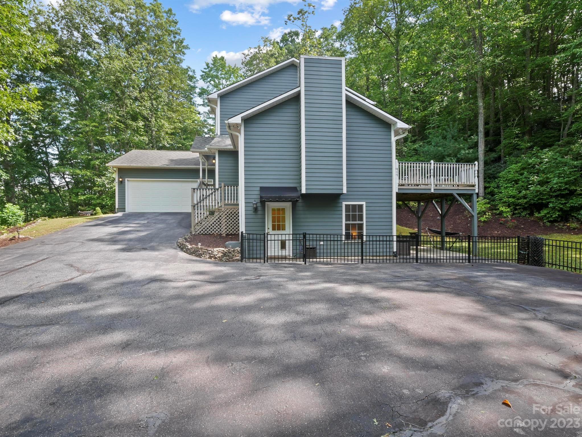 25 Falcon Crest Drive Fairview, NC 28730 - Photo 34 of 41 a view of a house with backyard and trees