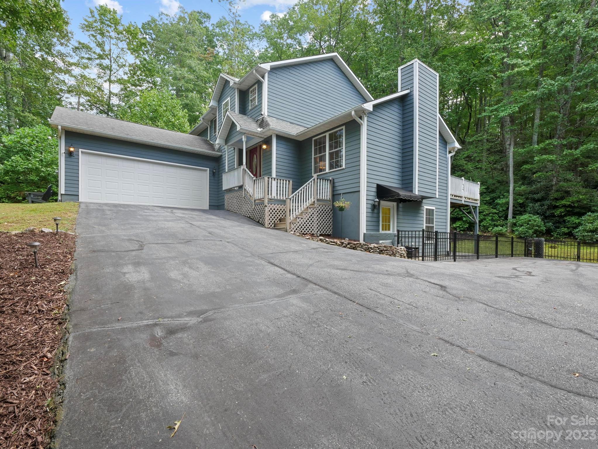 25 Falcon Crest Drive Fairview, NC 28730 - Photo 36 of 41 front view of a house with a street