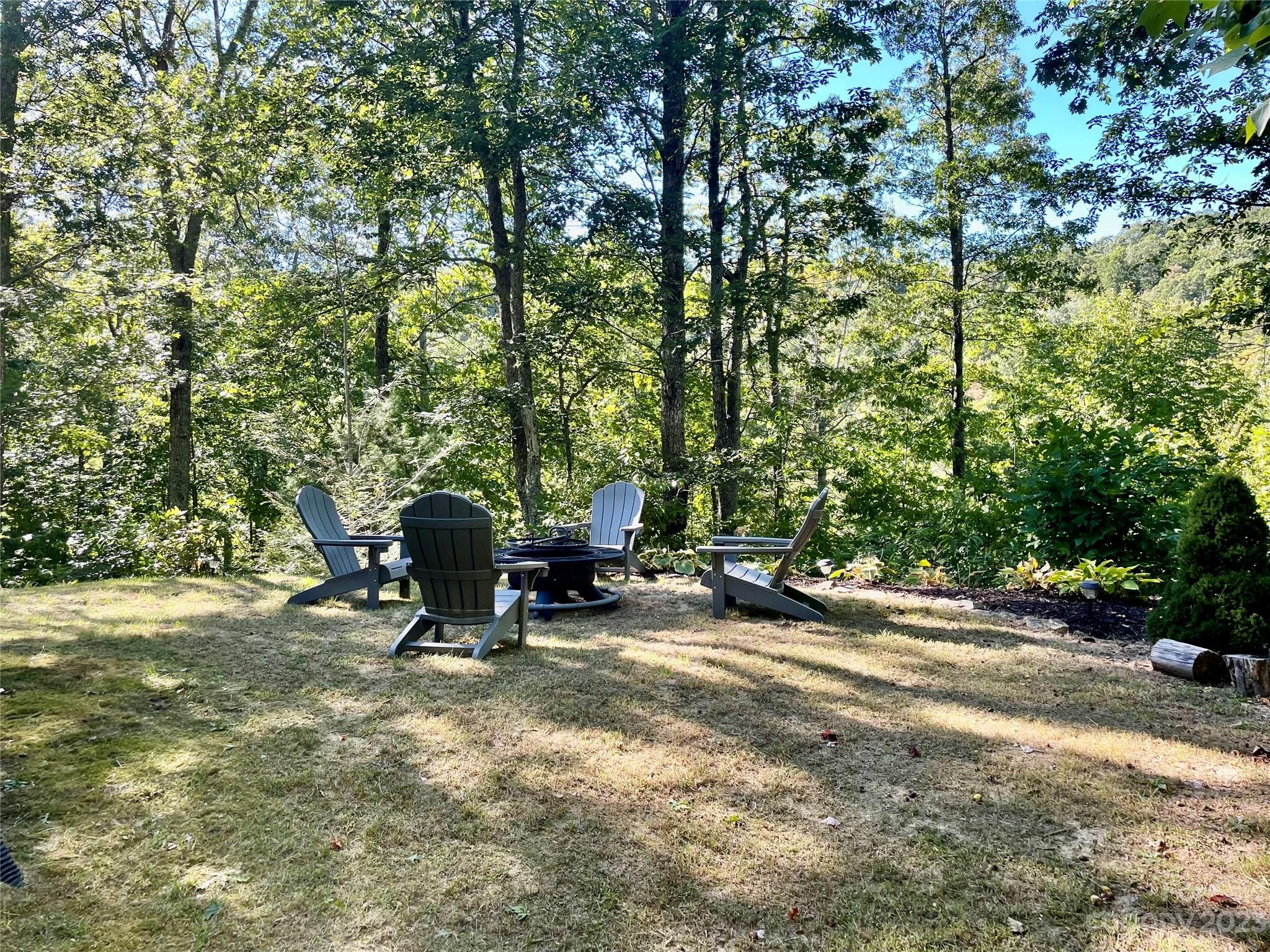25 Falcon Crest Drive Fairview, NC 28730 - Photo 40 of 41 a view of a bench in a parking space