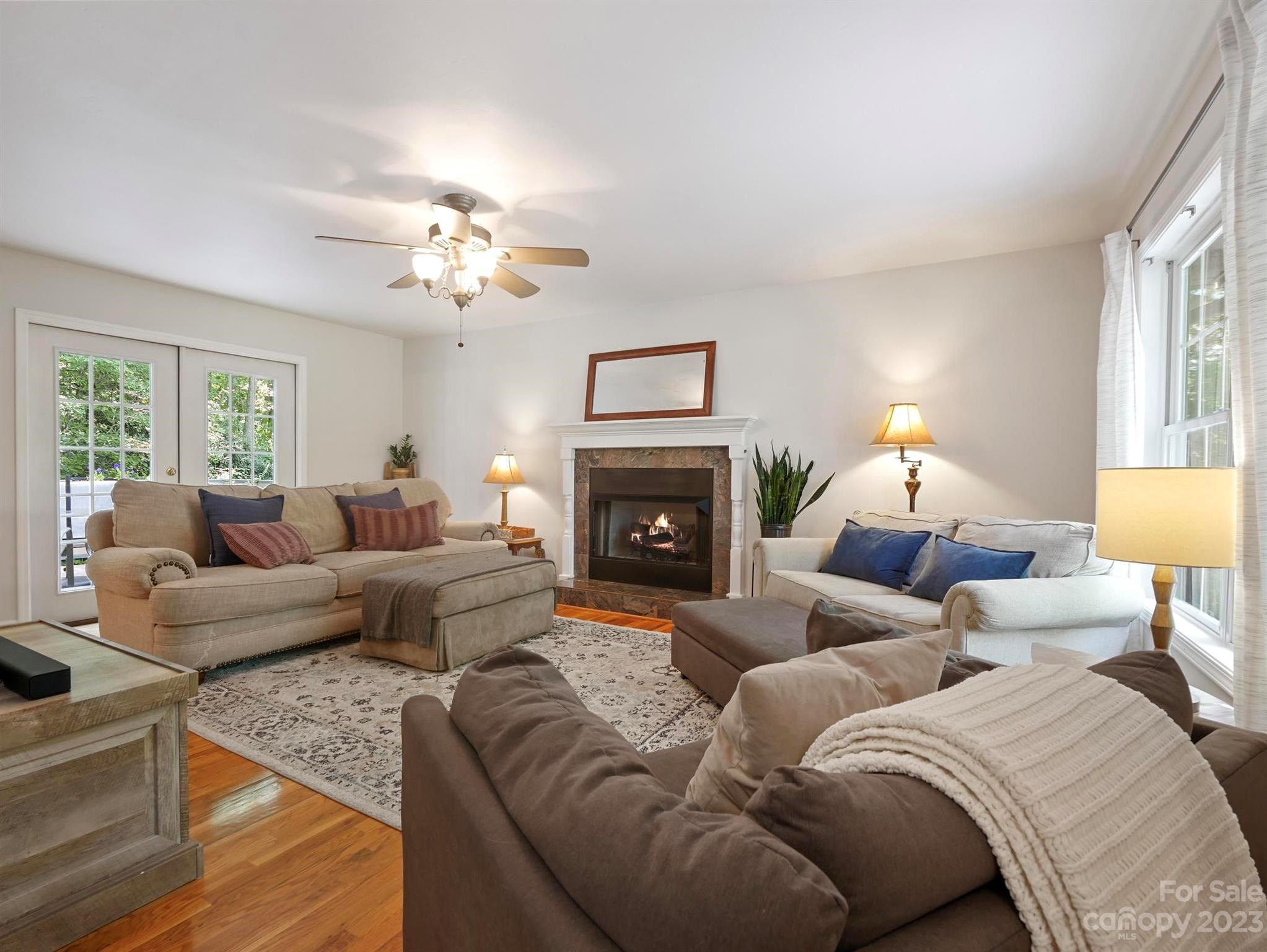 25 Falcon Crest Drive Fairview, NC 28730 - Photo 5 of 41 a living room with furniture fireplace and a window