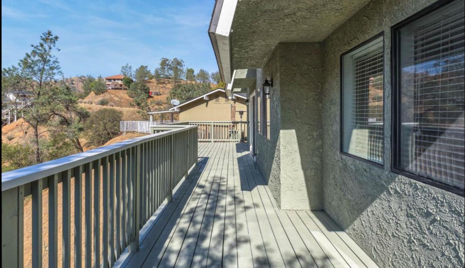 27817 Sky Harbour Road Friant, CA 93626 - Photo 6 of 36 a view of balcony with wooden floor and fence