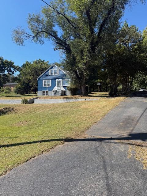 2469 Oak Level Road Bassett, VA 24055 - Photo 3 of 48 a view of a yard with a house in the background