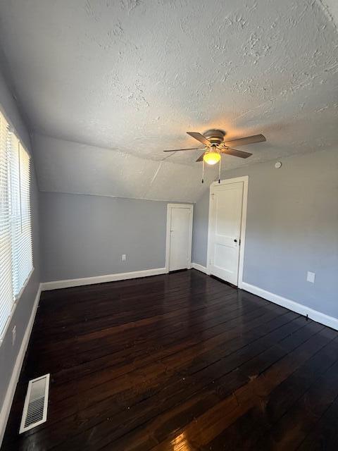 2469 Oak Level Road Bassett, VA 24055 - Photo 46 of 48 an empty room with wooden floor chandelier fan and windows