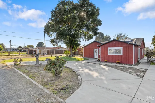 a swimming pool with outdoor seating and yard