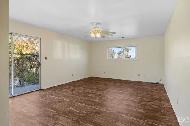 a kitchen with white cabinets and appliances