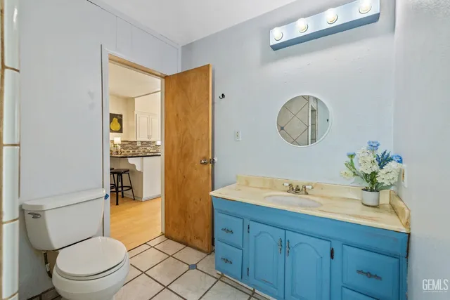 a living room with furniture a mirror and a window