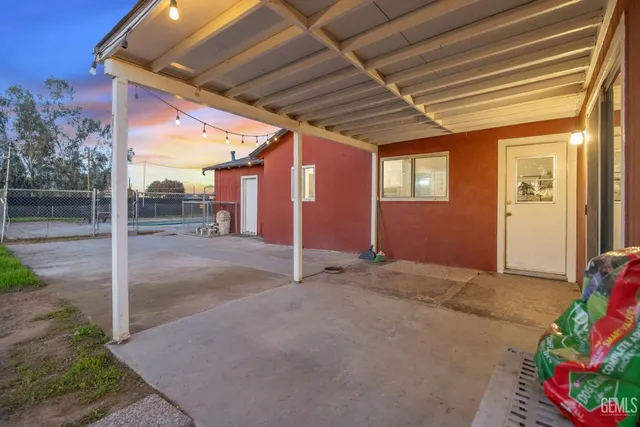 an aerial view of a house with a yard basket ball court and outdoor seating