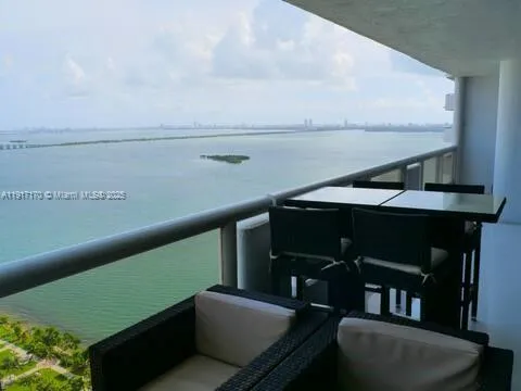 a view of roof deck with furniture