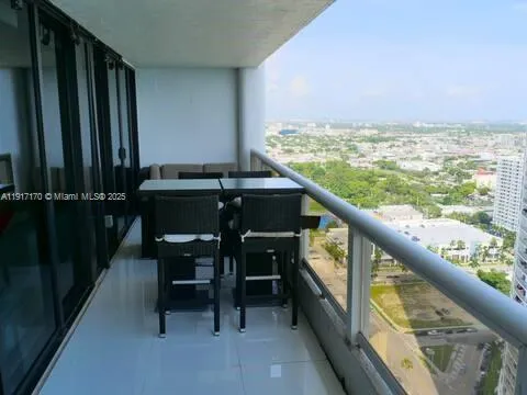 a view of a balcony with chairs