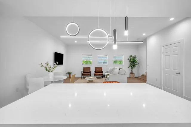 a very nice looking room with a large mirror and a large window