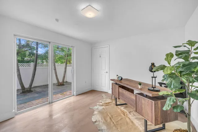 a bathroom with a granite countertop sink a mirror a vanity and a shower