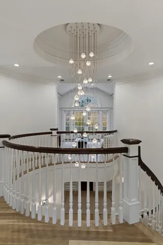 a spacious bedroom with a bed a couch and dresser