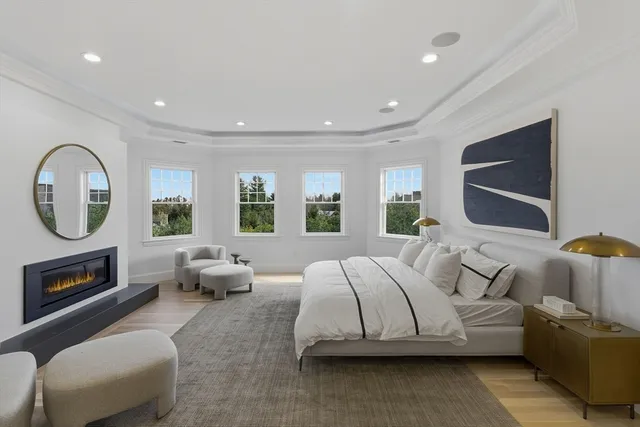 a spacious bedroom with a bed and window