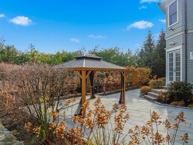 an aerial view of a house with a yard basket ball court and outdoor seating