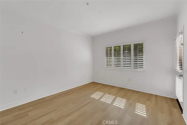 a bathroom with a glass shower door and a mirror