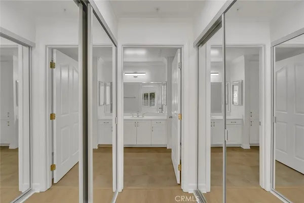 a bathroom with a shower sink and mirror