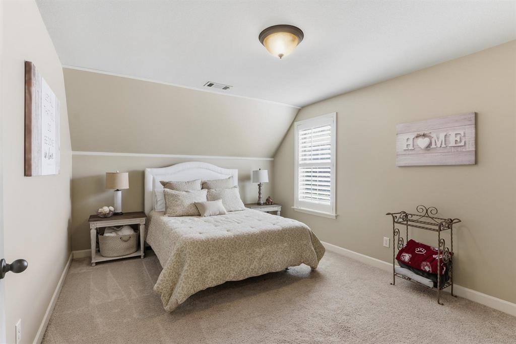 1301 Conser Street Collierville, TN 38017 - Photo 27 of 39 a bedroom with a bed and a chair