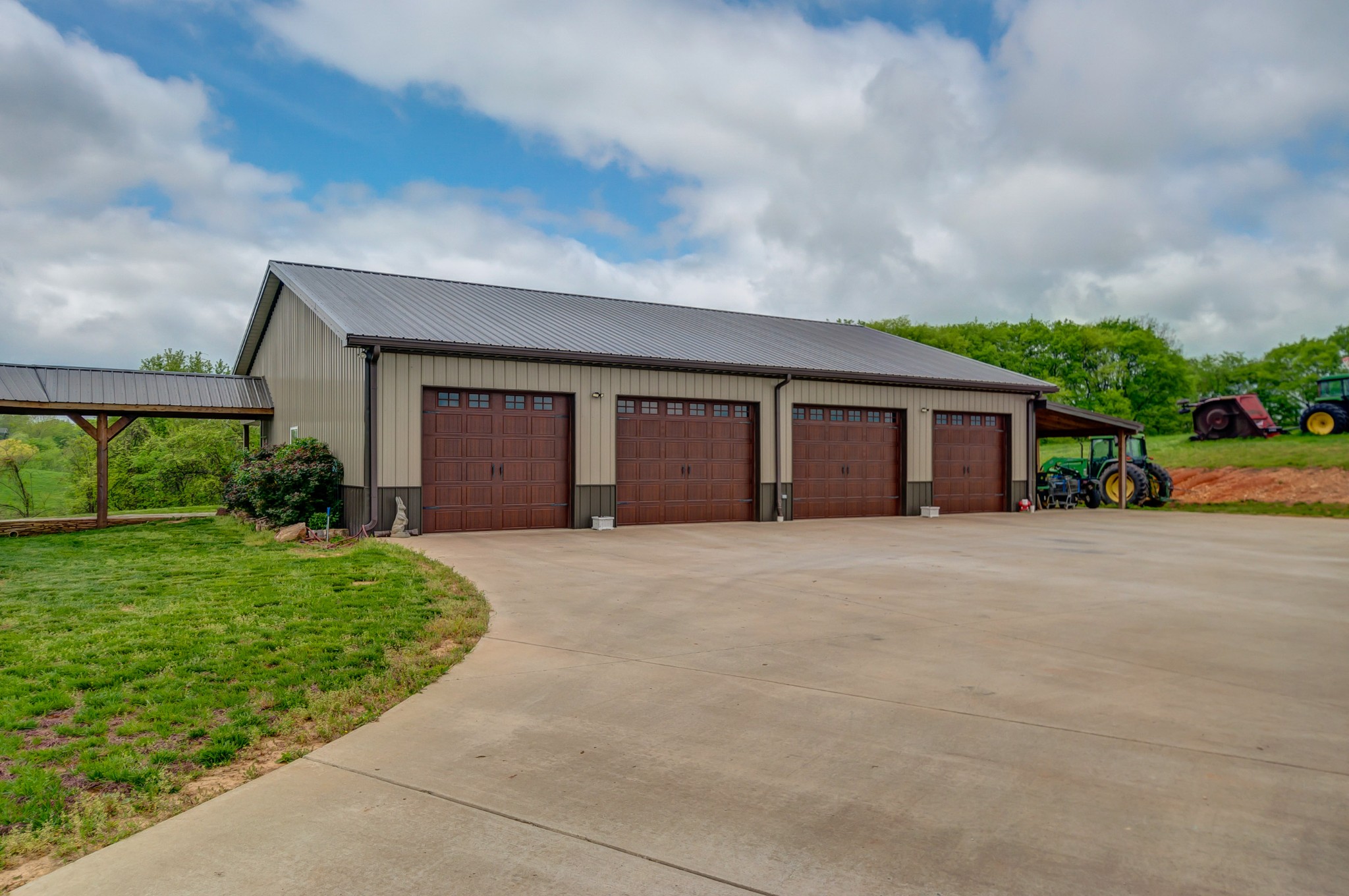 2348 Tom Fitzgerald Road Columbia, TN 38401 - Photo 29 of 47 a front view of a house with a yard and garage