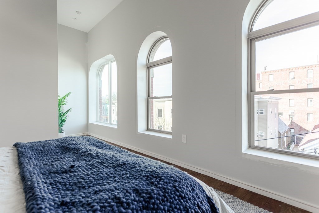 178 Elm Street, Unit 5 Cambridge, MA 02139 - Photo 11 of 14 a front view of a house with a large window