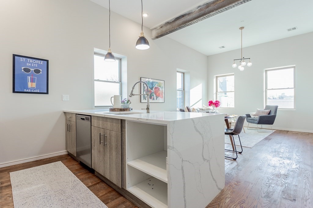 178 Elm Street, Unit 5 Cambridge, MA 02139 - Photo 6 of 14 a room with granite countertop furniture and a chandelier
