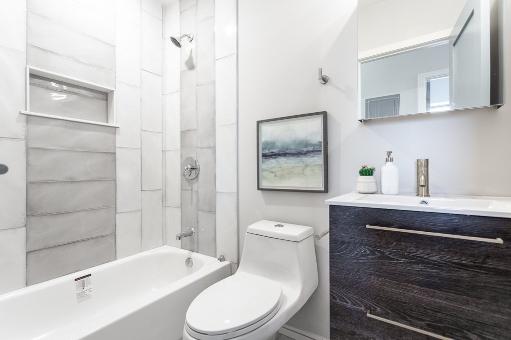 178 Elm Street, Unit 5 Cambridge, MA 02139 - Photo 8 of 14 a bathroom with a sink a toilet and shower
