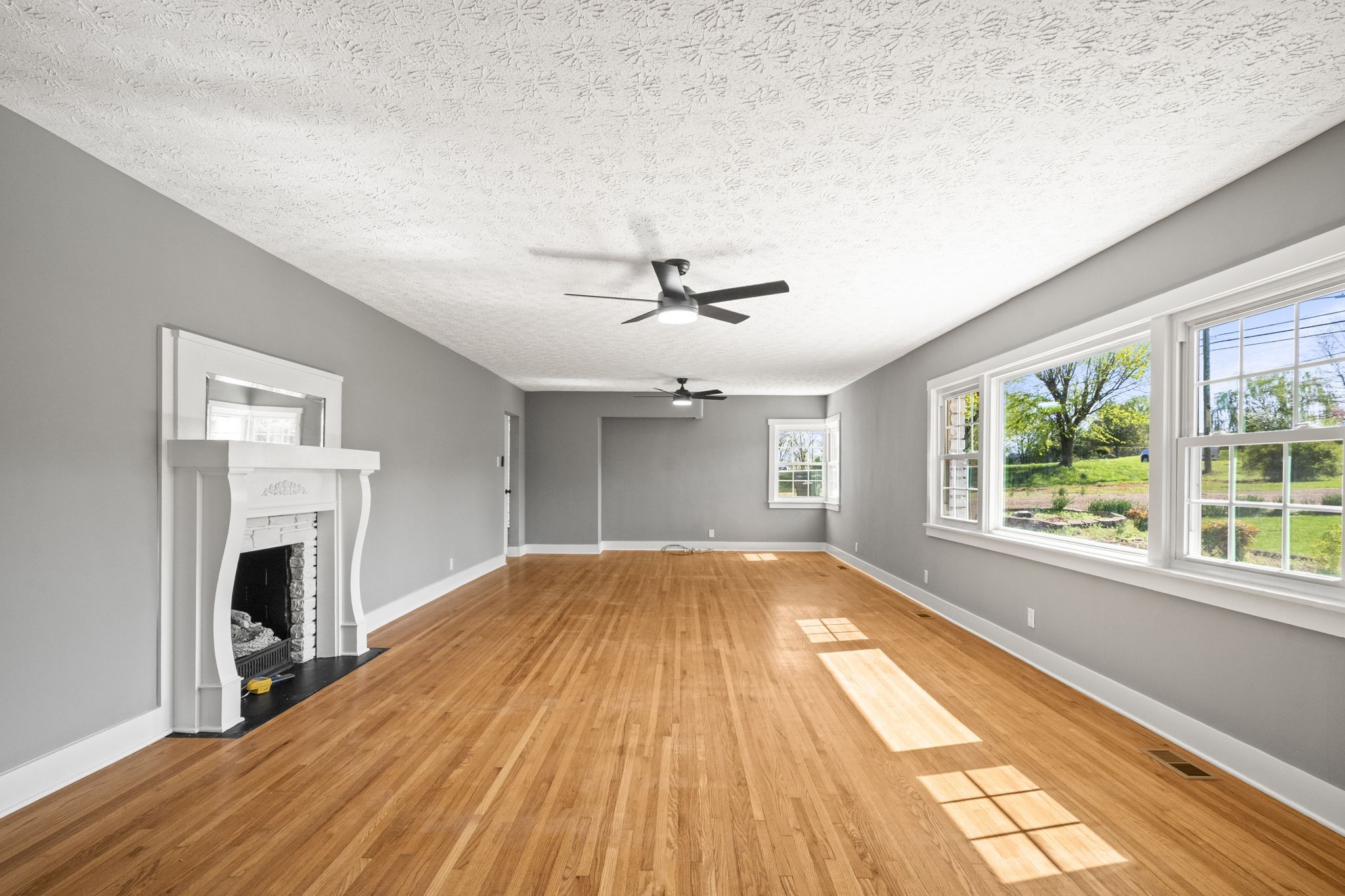 1503 5th Avenue West Springfield, TN 37172 - Photo 13 of 57 wooden floor in an empty room with a fireplace