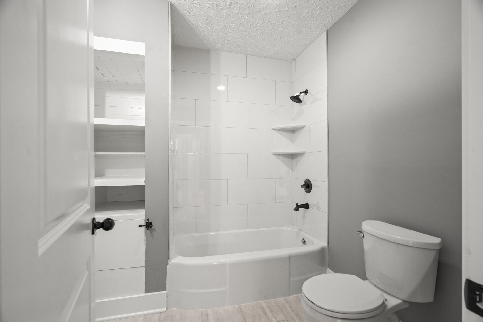 1503 5th Avenue West Springfield, TN 37172 - Photo 17 of 57 a white toilet sitting next to a bath tub