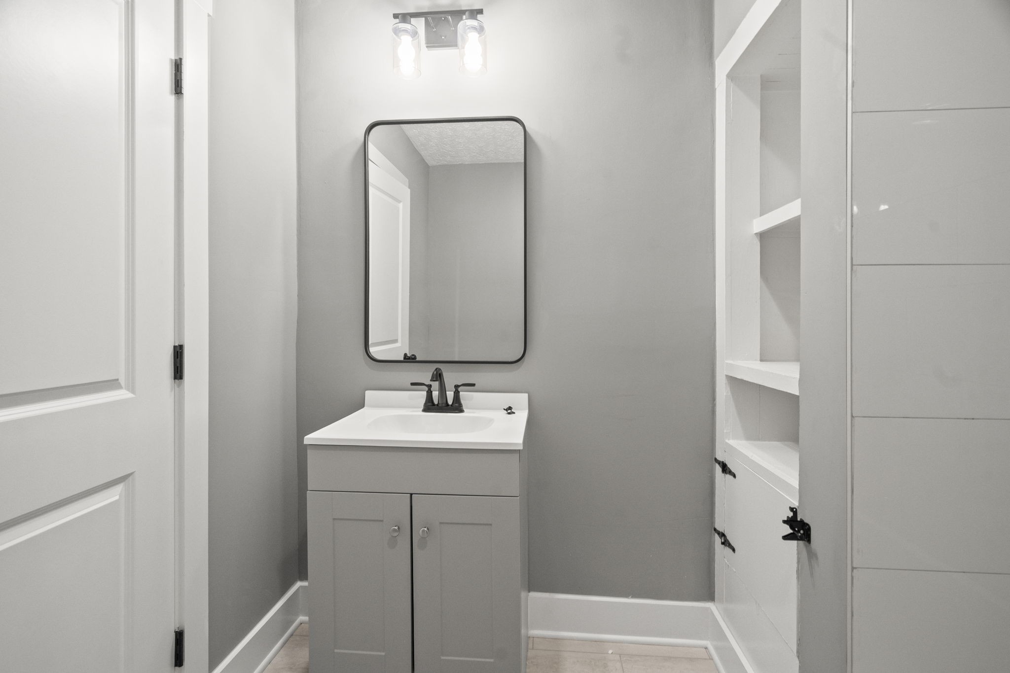 1503 5th Avenue West Springfield, TN 37172 - Photo 18 of 57 a bathroom with a sink and a mirror
