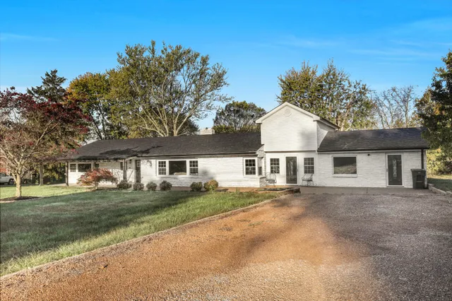 front view of a house next to a yard